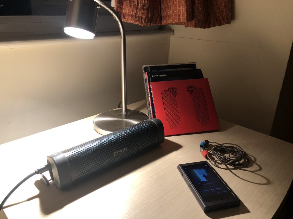 portable audio set up in hotel room, including Bluetooth speaker and Sony DAP